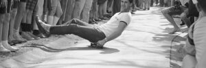 man on skateboard in black and white