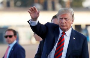 U.S. President Donald Trump gestures as he arrives at Helsinki-Vantaa airport in Vantaa