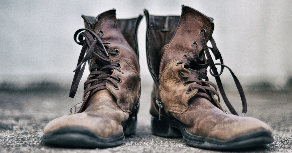 Old, broken in boots. Proletarians are hardworking.