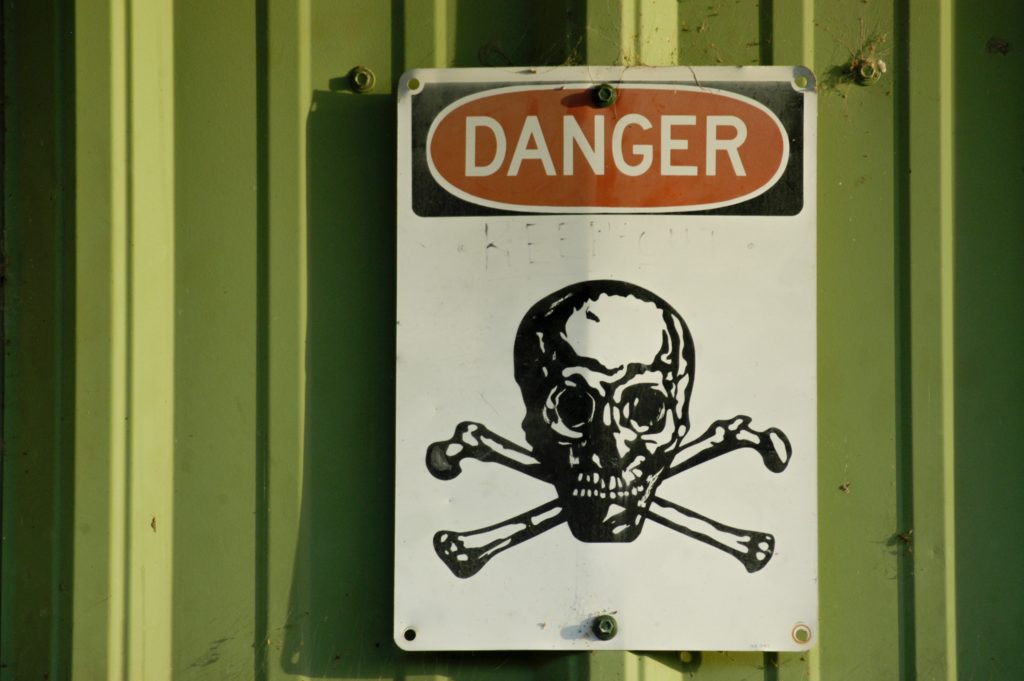 Danger sign with skull-and-crossbones symbol.