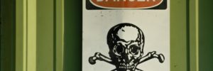 Danger sign with skull-and-crossbones symbol.