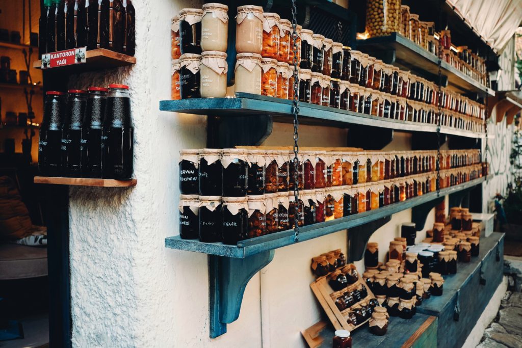 Shelf of prepped jars full of food.