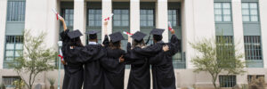 University students in graduation gowns