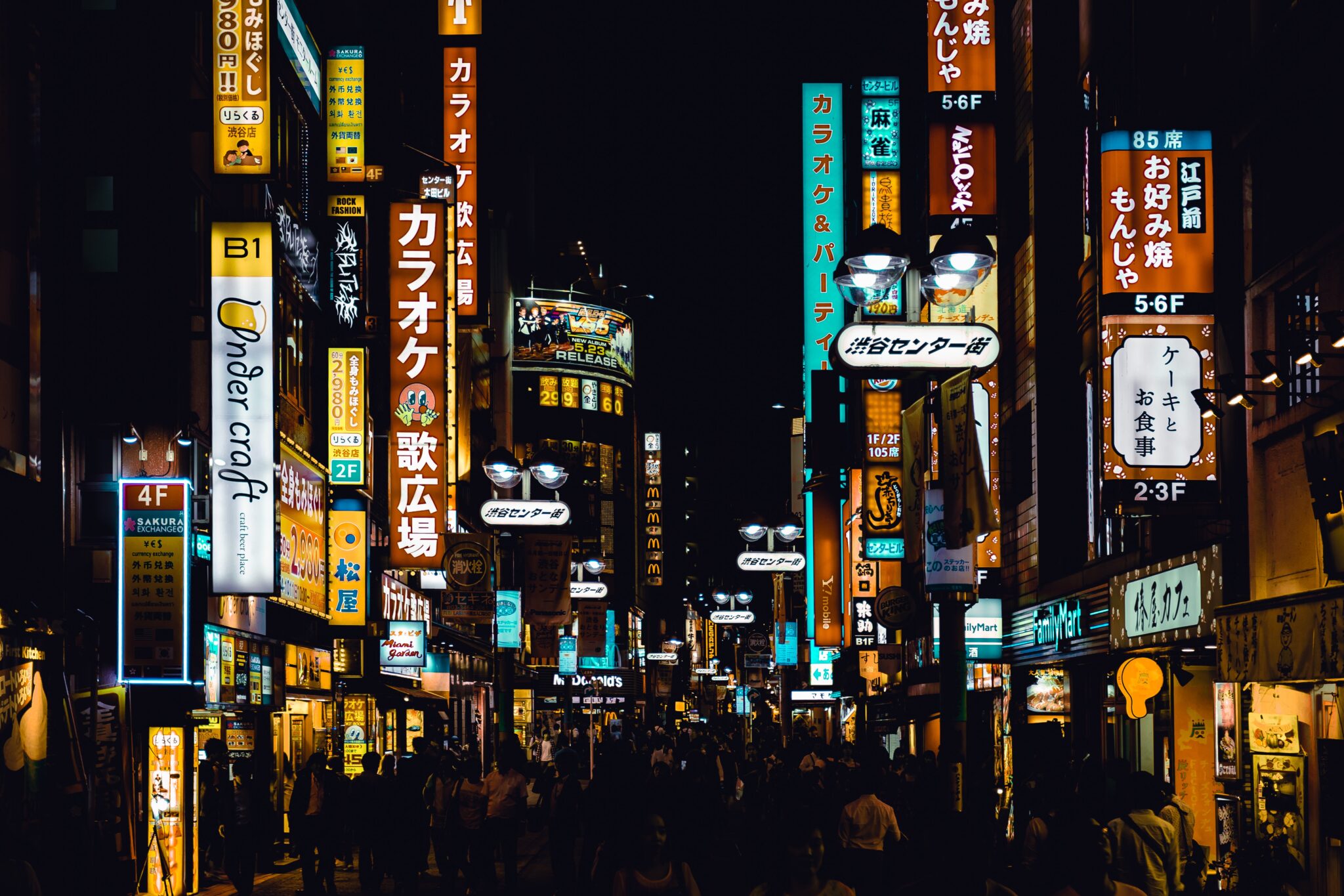A photo of a street in Tokyo, Japan, taken at night. 