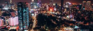 An aerial photograph of Ho Chi Minh City at night. The photo accompanies a blog post about a trip Hogan took to visit a distributor, Talent Assessments Vietnam. During the trip, Hogan discussed inclusive leadership in Vietnam.