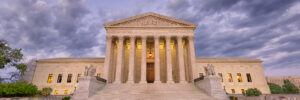 A low-angle photo of the US Supreme Court building against a cloudy backdrop accompanies a statement about Hogan's position on a recent ruling that invalidated race-conscious admissions programs at colleges and universities. Hogan is committed to equal opportunity, irrespective of changes in affirmative action legislation.