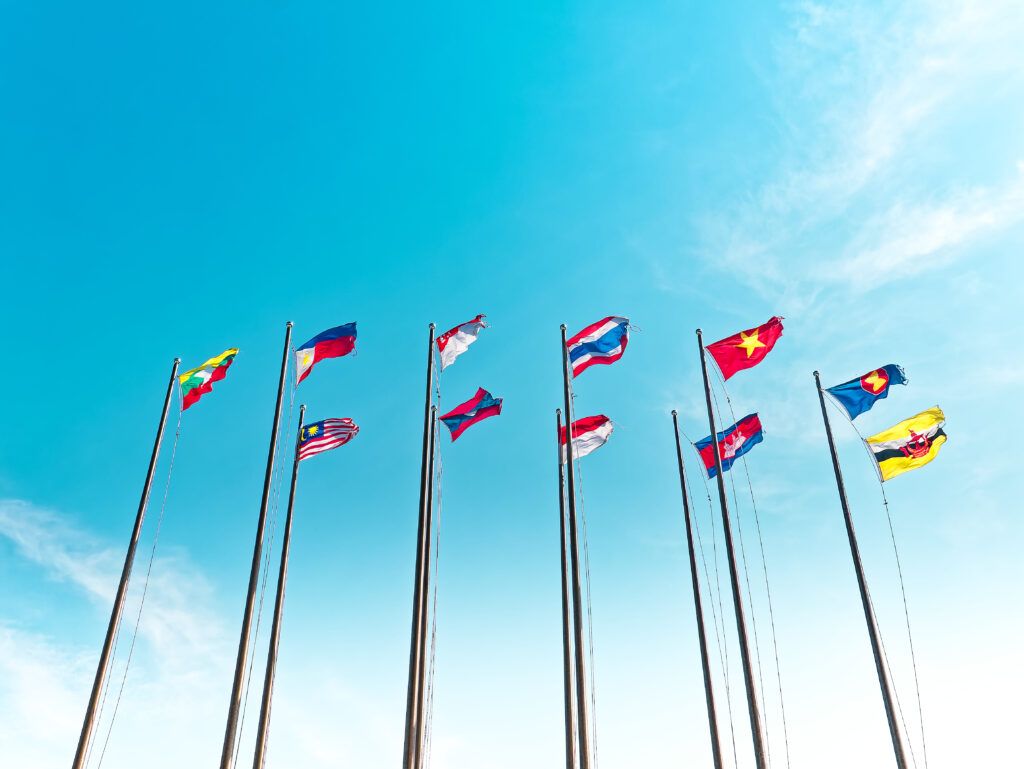 An array of Asian flags wave against a blue sky. The photo was shot from a low angle and accompanies a blog post about why culture matters.