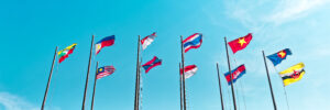 An array of Asian flags wave against a blue sky. The photo was shot from a low angle and accompanies a blog post about why culture matters.