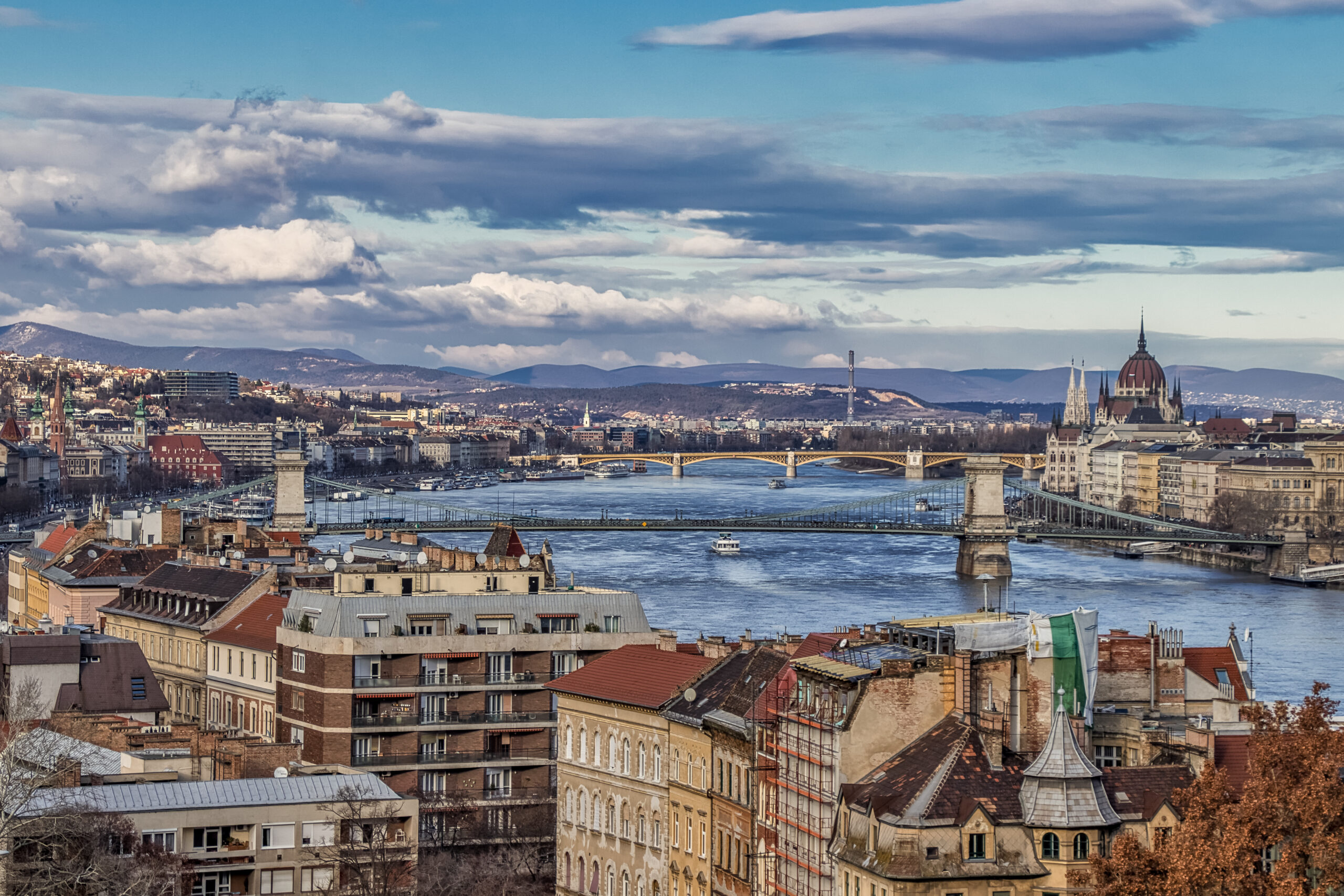 Dramatic cloudscape over Budapest cityscape with traditional typical buildings